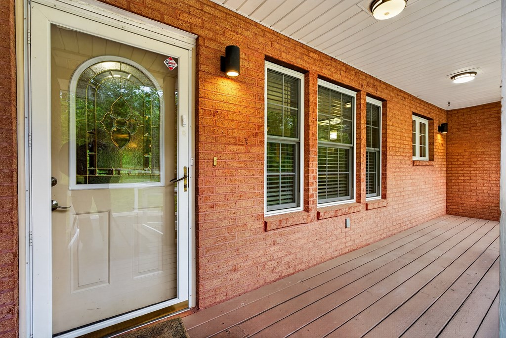 80 Sowers Road Blue Ridge, GA 30513 - Photo 3 of 58 a view of a brick house with wooden floor and a window