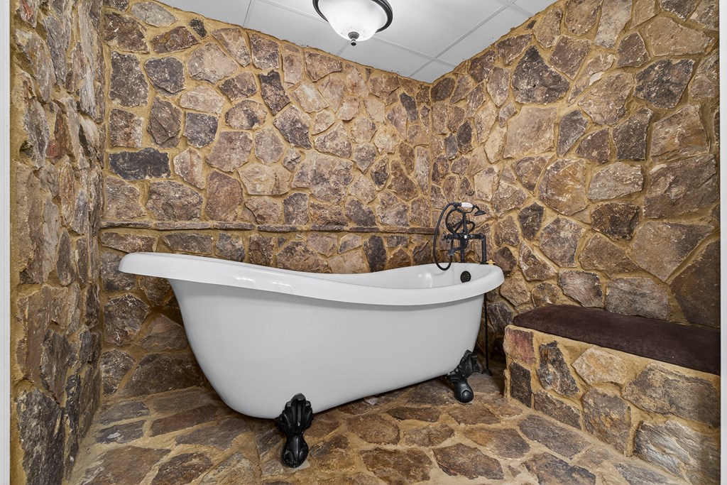 80 Sowers Road Blue Ridge, GA 30513 - Photo 39 of 58 a bathroom with a bathtub and shower
