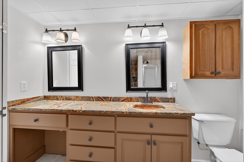 80 Sowers Road Blue Ridge, GA 30513 - Photo 40 of 58 a bathroom with a granite countertop sink vanity and mirror