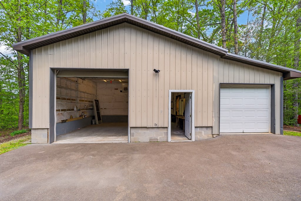 80 Sowers Road Blue Ridge, GA 30513 - Photo 47 of 58 a view of a house with a garage and yard