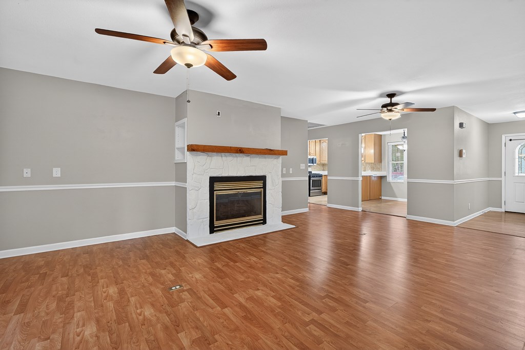 80 Sowers Road Blue Ridge, GA 30513 - Photo 5 of 58 a view of a livingroom with a fireplace a ceiling fan a fireplace and windows