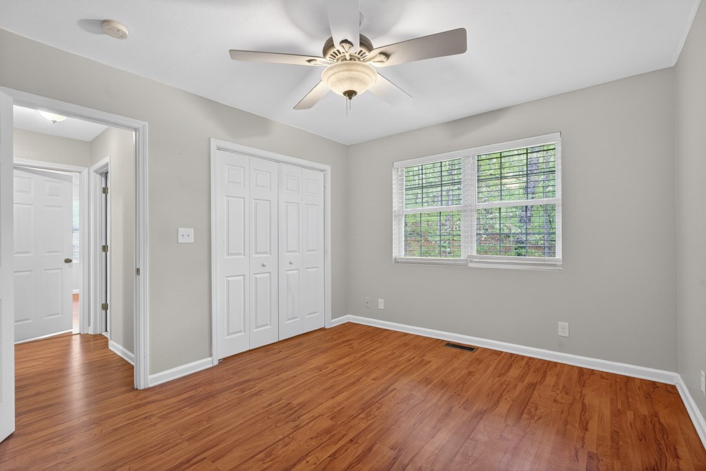 80 Sowers Road Blue Ridge, GA 30513 - Photo 6 of 58 a view of an empty room with wooden floor and a window