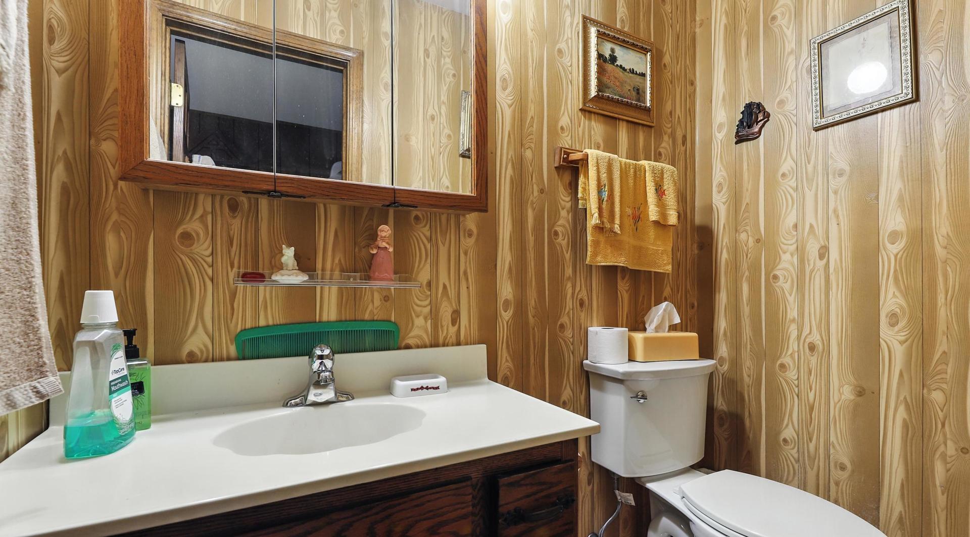 953 Surrey Road Addison, IL 60101 - Photo 16 of 21 a bathroom with a sink toilet and shower
