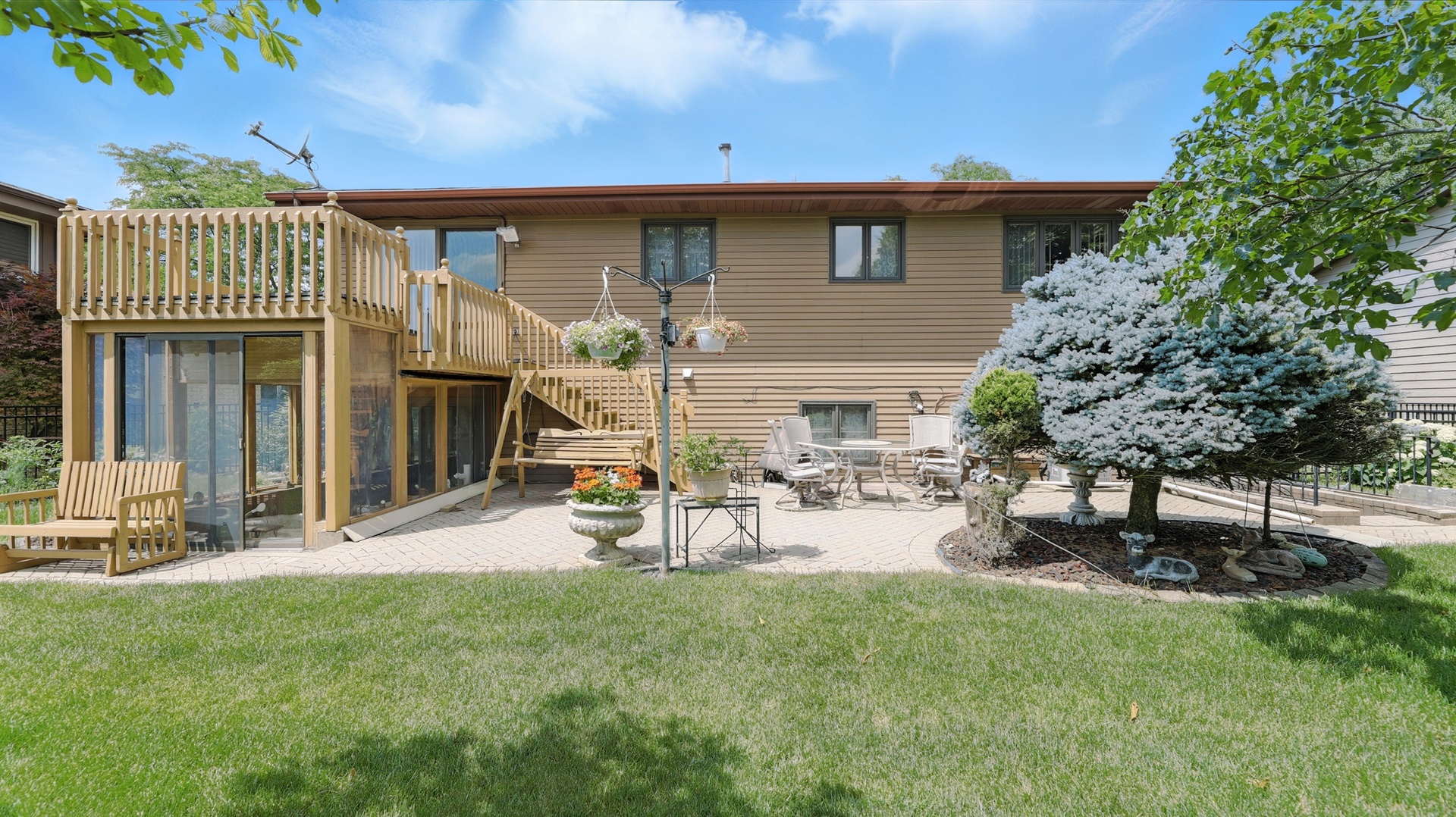953 Surrey Road Addison, IL 60101 - Photo 18 of 21 a view of a house with backyard and sitting area