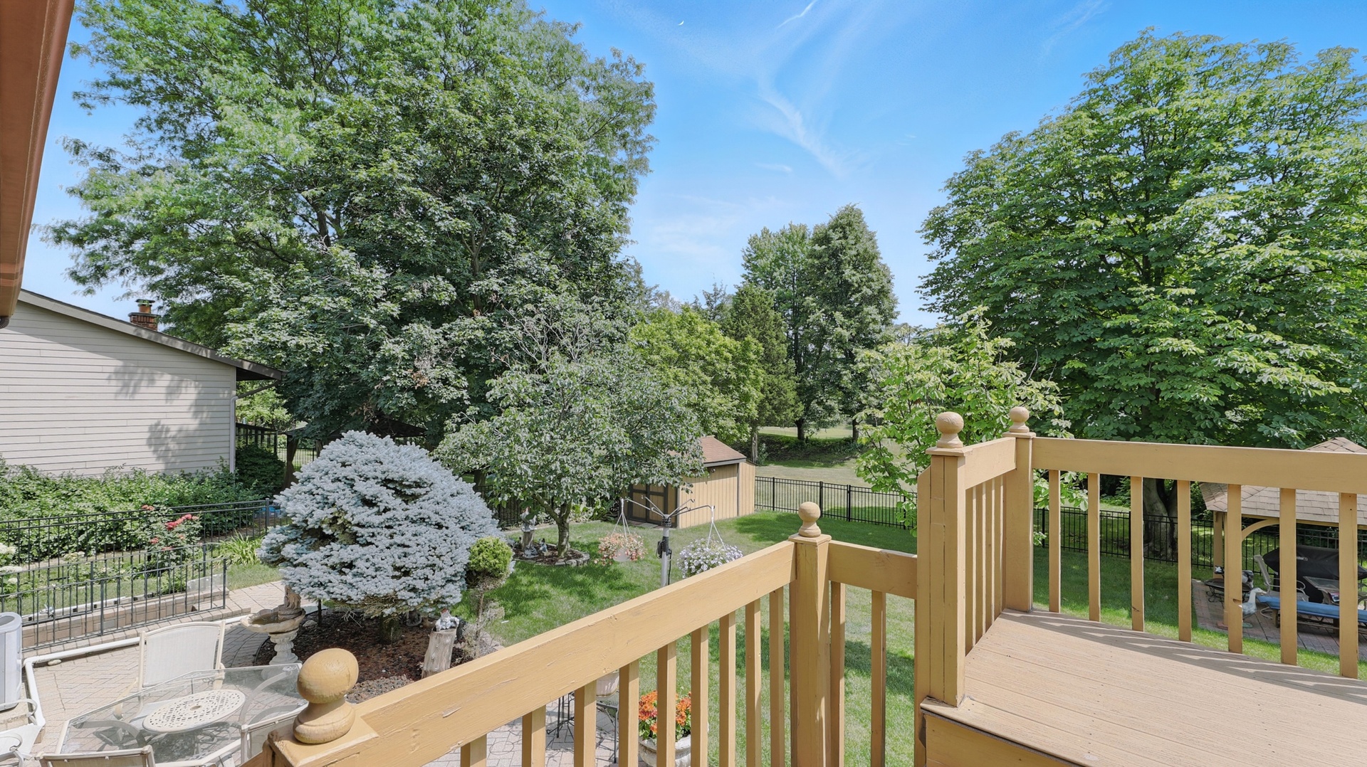 953 Surrey Road Addison, IL 60101 - Photo 19 of 21 a view of a wooden deck and a backyard