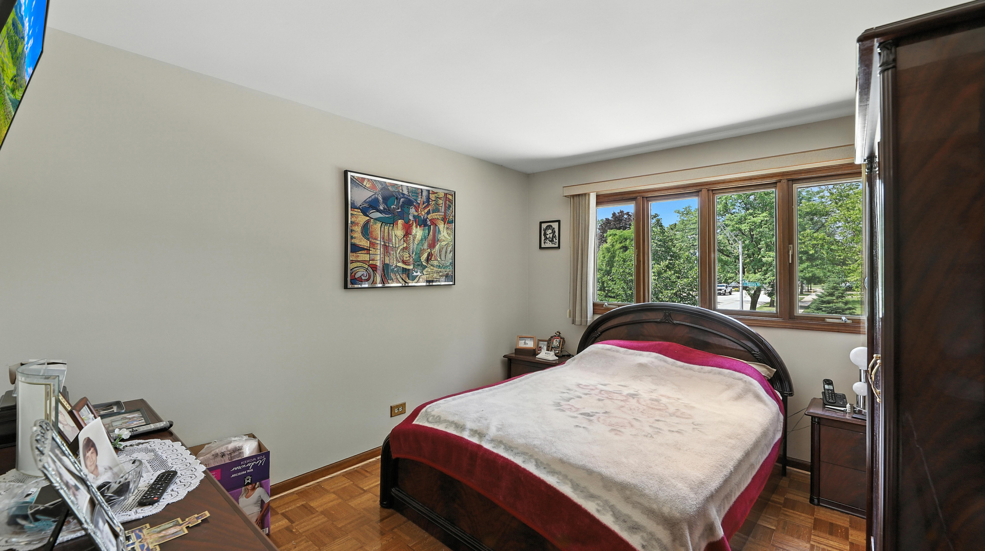 953 Surrey Road Addison, IL 60101 - Photo 10 of 21 a bed sitting in a bedroom next to a window