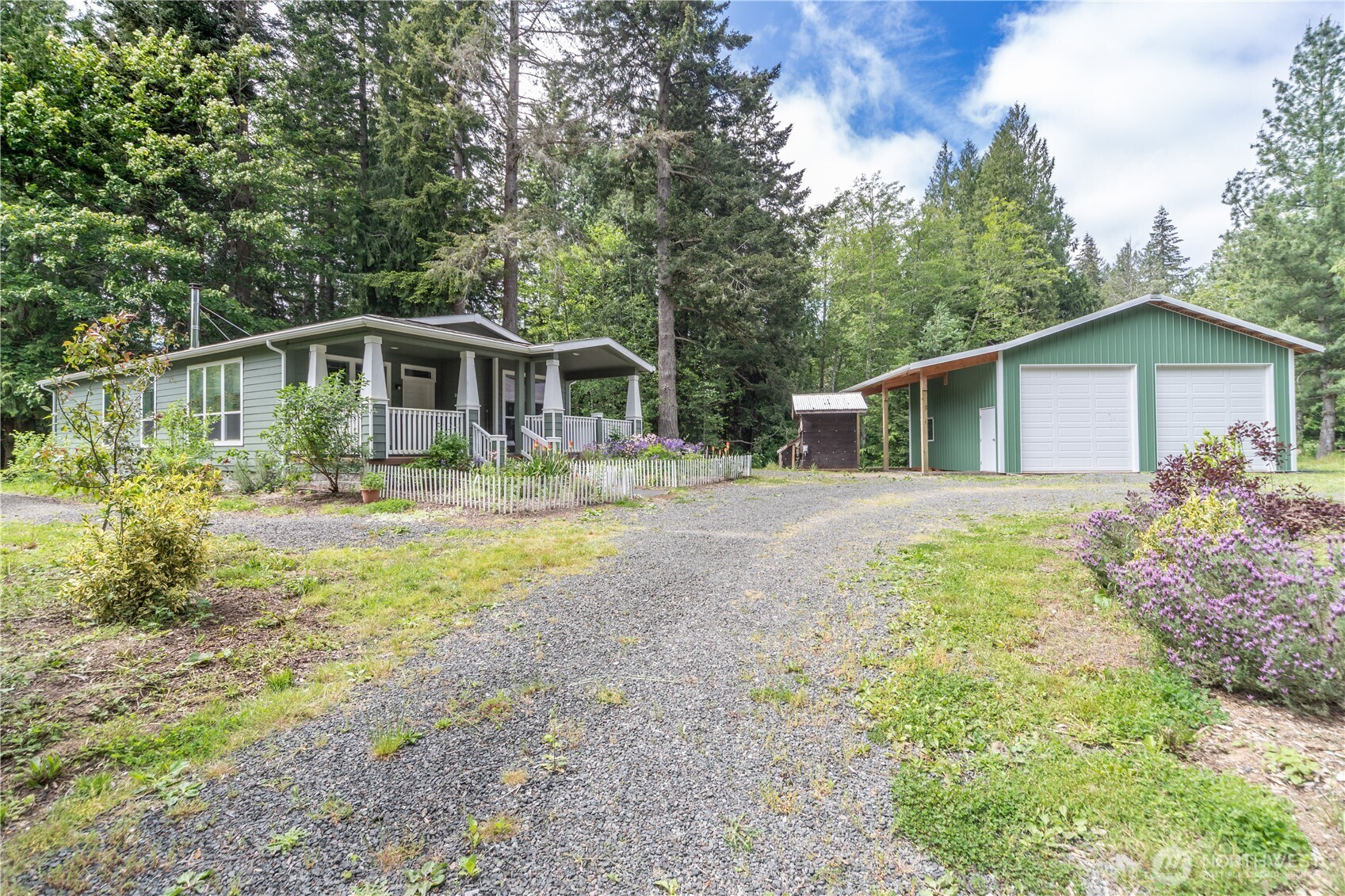 290 Werner Road Port Ludlow, WA 98365 - Photo 2 of 40 a front view of a house with garden