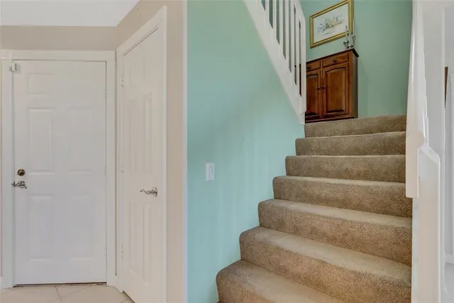 a bedroom with a bed and lamp