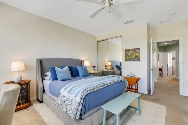 a bathroom with double vanity sinks a large mirror and a window