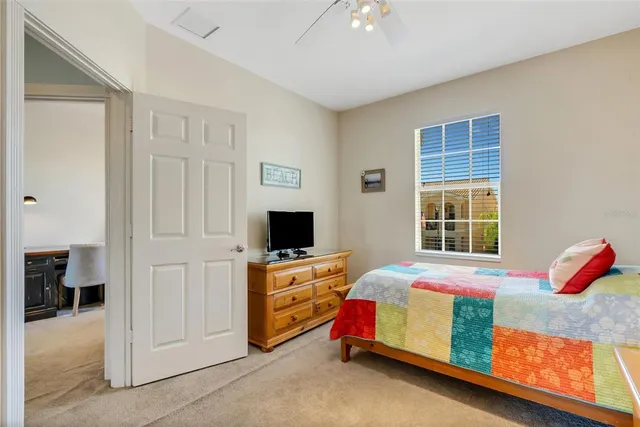 a bathroom with a sink mirror and vanity
