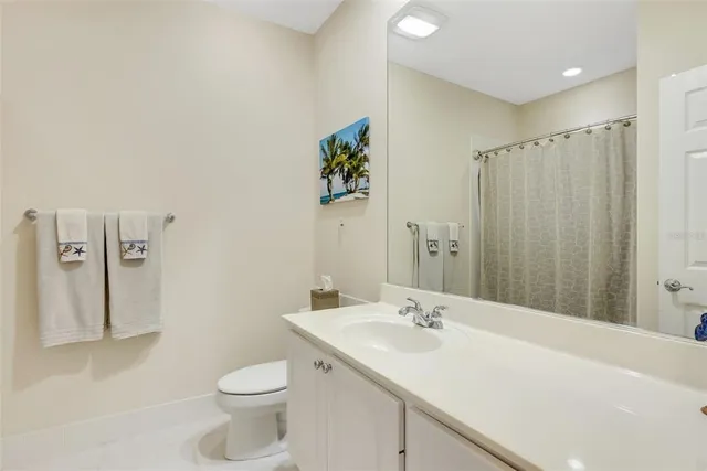 a bathroom with a shower curtain and a shower curtain