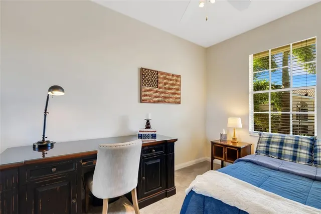 a view of a dining room with furniture and window