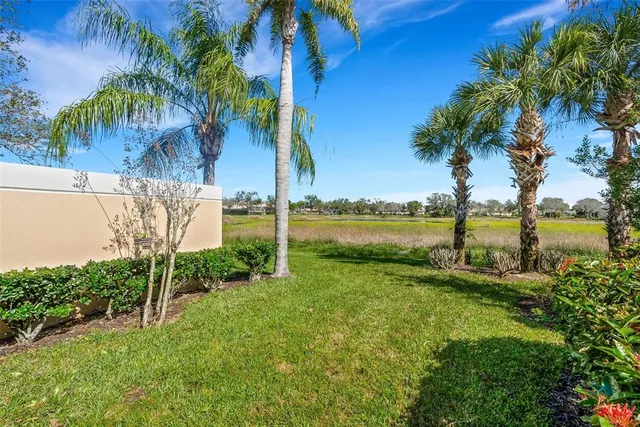 a view of a lake with houses in the back