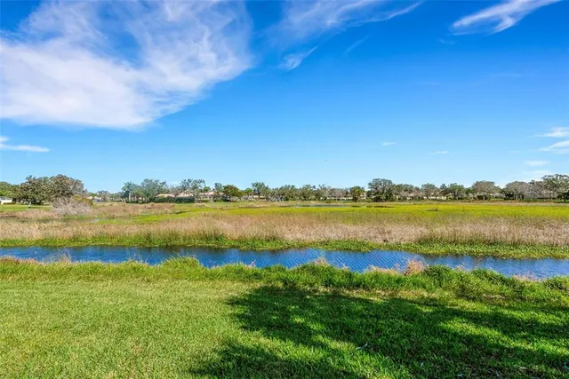 a front view of a house with a yard and a garage