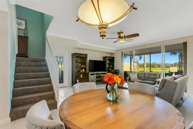 a kitchen with stainless steel appliances a refrigerator and a stove top oven with wooden floor