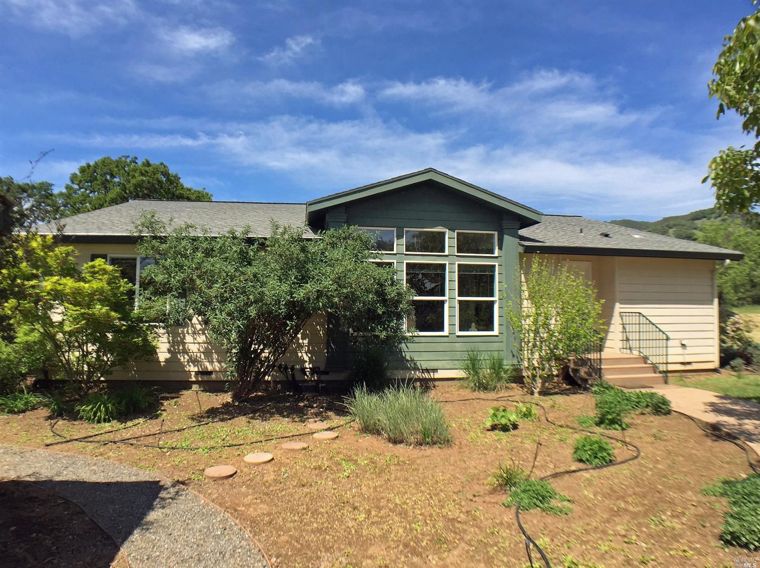 3000 Rd I Redwood Valley, CA 95470 - Photo 1 of 1 a front view of a house with garden
