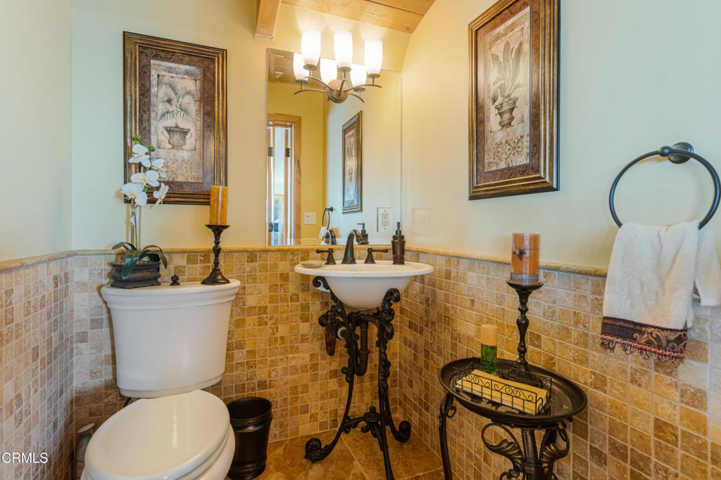 268 Sunset Drive Oxnard, CA 93035 - Photo 15 of 32 a bathroom with a sink mirror and a toilet