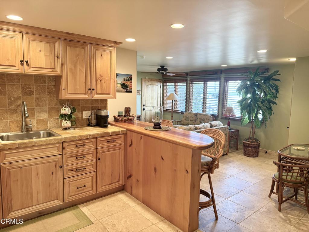268 Sunset Drive Oxnard, CA 93035 - Photo 24 of 32 a kitchen with a sink refrigerator and cabinets