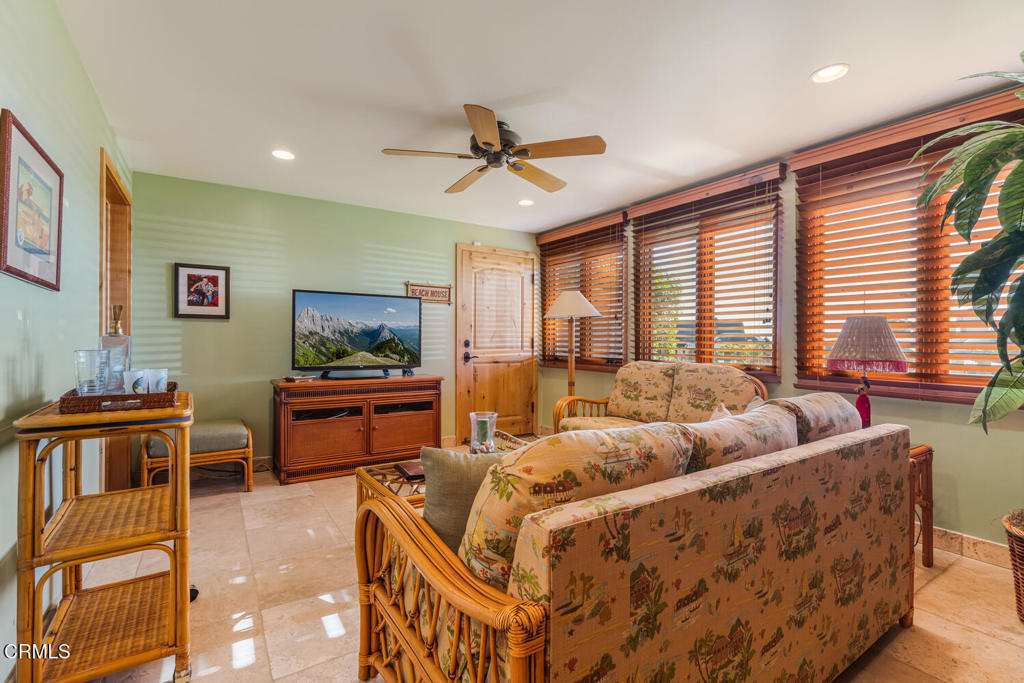 268 Sunset Drive Oxnard, CA 93035 - Photo 25 of 32 a living room with furniture and a floor to ceiling window