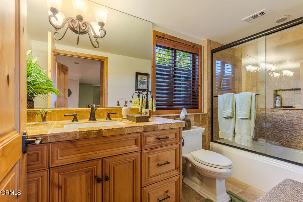 268 Sunset Drive Oxnard, CA 93035 - Photo 28 of 32 a bathroom with a double vanity sink mirror and toilet