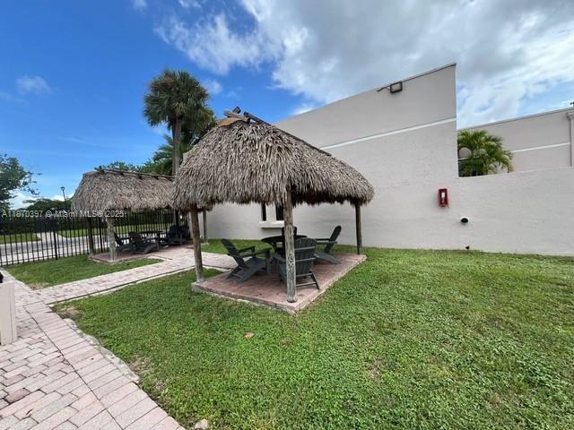 8420 Southwest 133rd Avenue Road, Unit 213 Miami, FL 33183 - Photo 13 of 16 a view of a backyard with sitting area