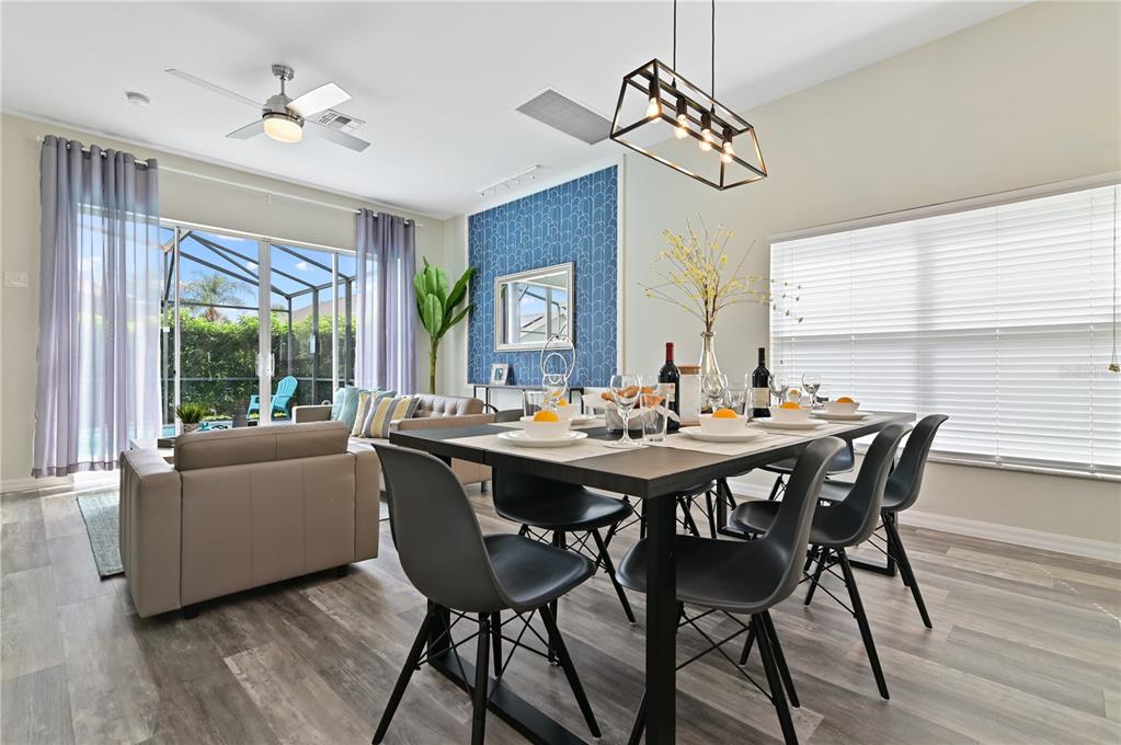 16640 Palm Spring Drive Clermont, FL 34714 - Photo 19 of 79 a view of a dining room with furniture window and wooden floor