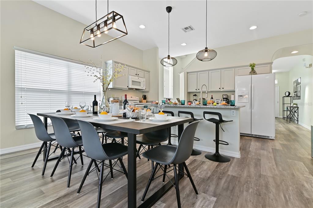 16640 Palm Spring Drive Clermont, FL 34714 - Photo 20 of 79 a view of a dining area with furniture and wooden floor