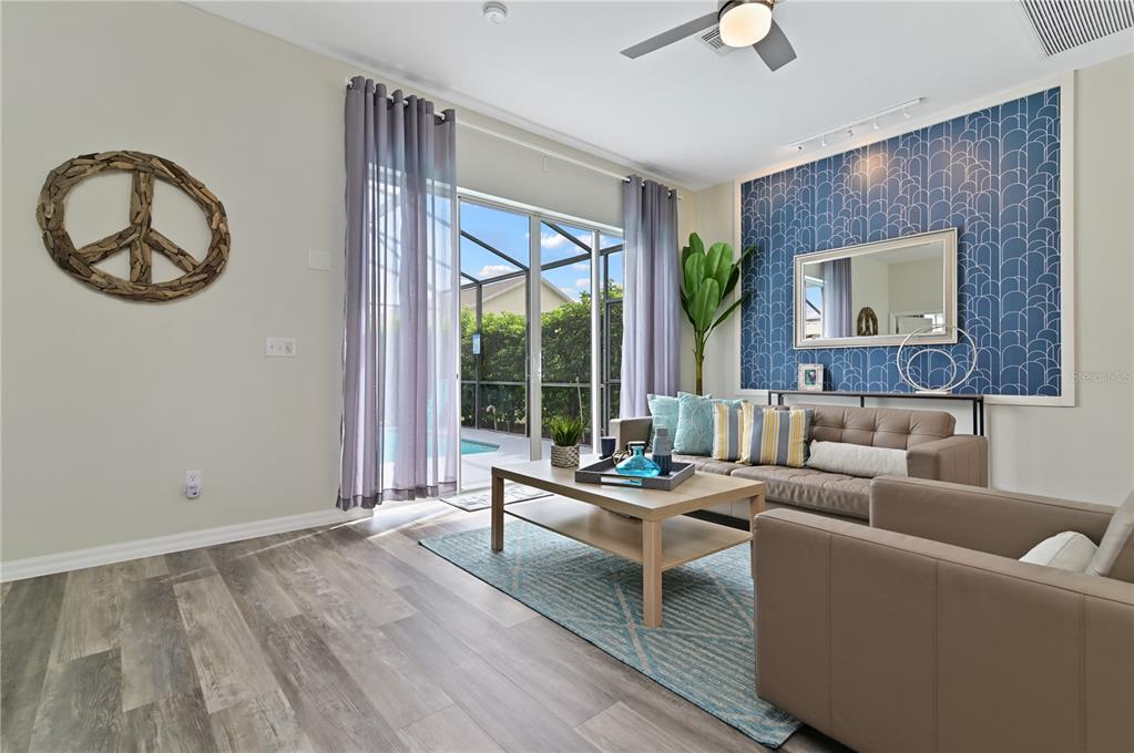 16640 Palm Spring Drive Clermont, FL 34714 - Photo 24 of 79 a living room with furniture and a large window