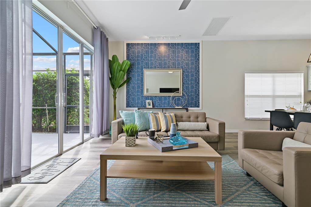 16640 Palm Spring Drive Clermont, FL 34714 - Photo 25 of 79 a living room with furniture and a large window