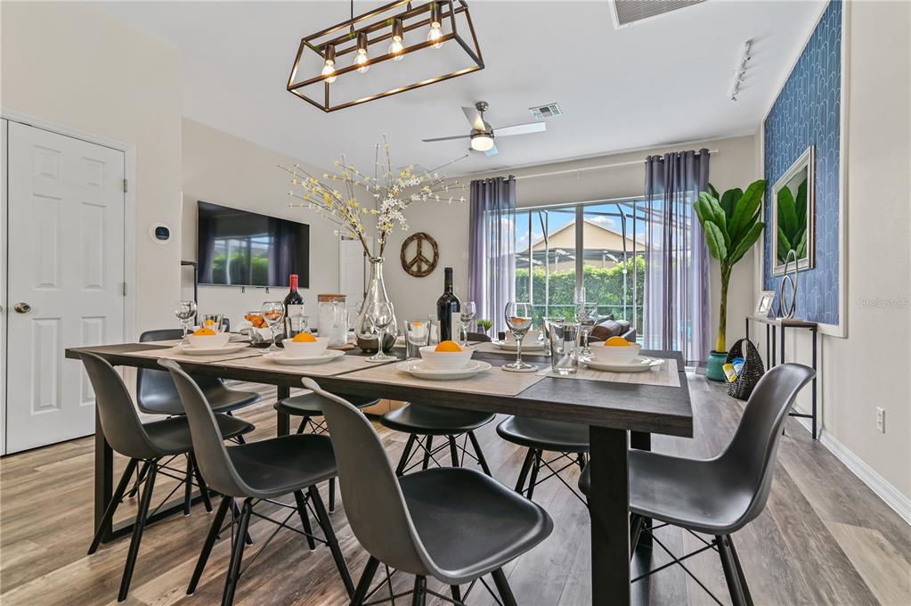 16640 Palm Spring Drive Clermont, FL 34714 - Photo 26 of 79 a view of a dining room with furniture window and wooden floor