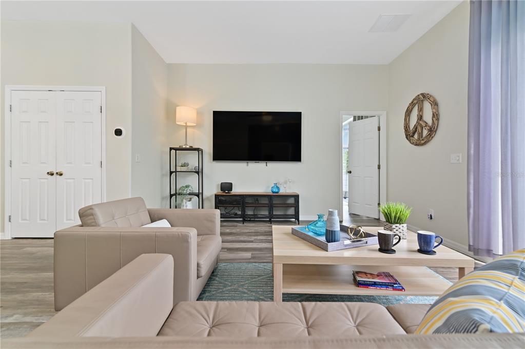 16640 Palm Spring Drive Clermont, FL 34714 - Photo 28 of 79 a living room with fireplace furniture and a flat screen tv
