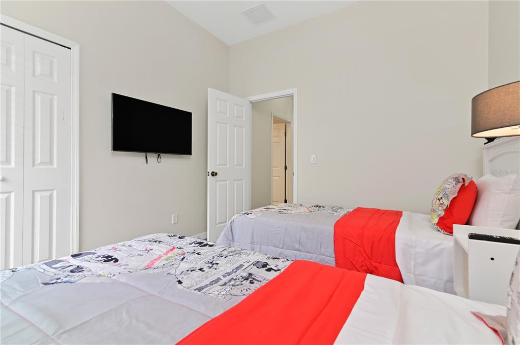 16640 Palm Spring Drive Clermont, FL 34714 - Photo 41 of 79 a bedroom with a bed and a flat screen tv