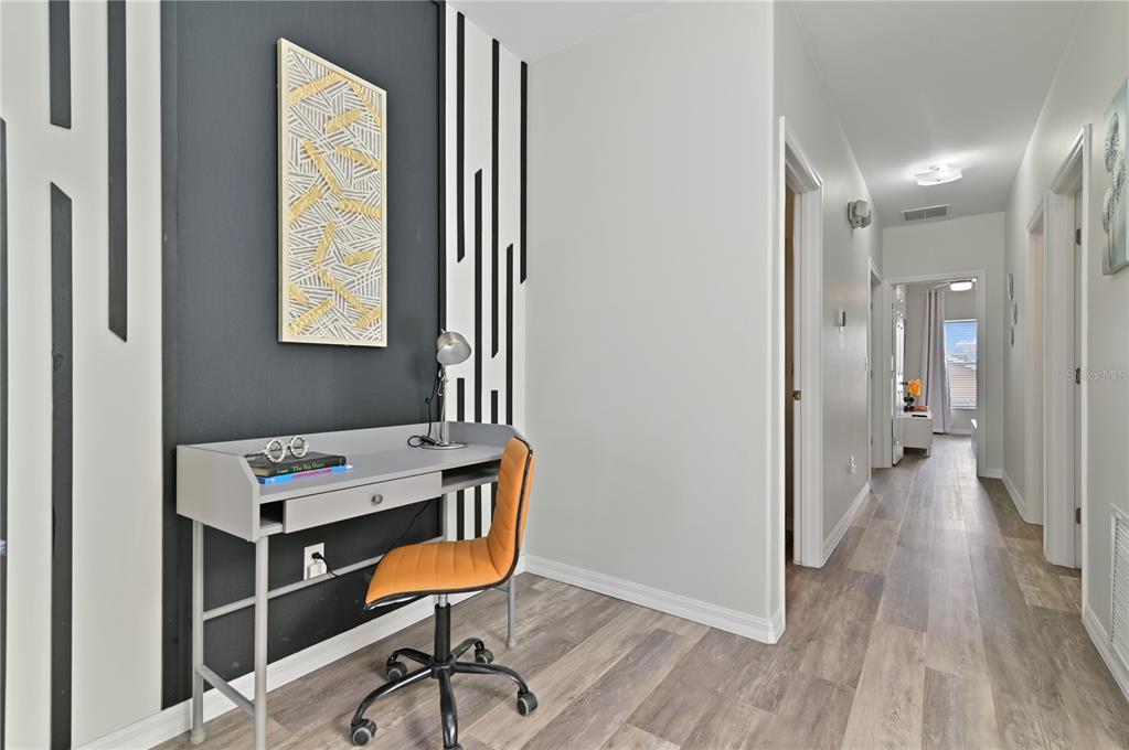 16640 Palm Spring Drive Clermont, FL 34714 - Photo 43 of 79 a view of a room with furniture and wooden floor