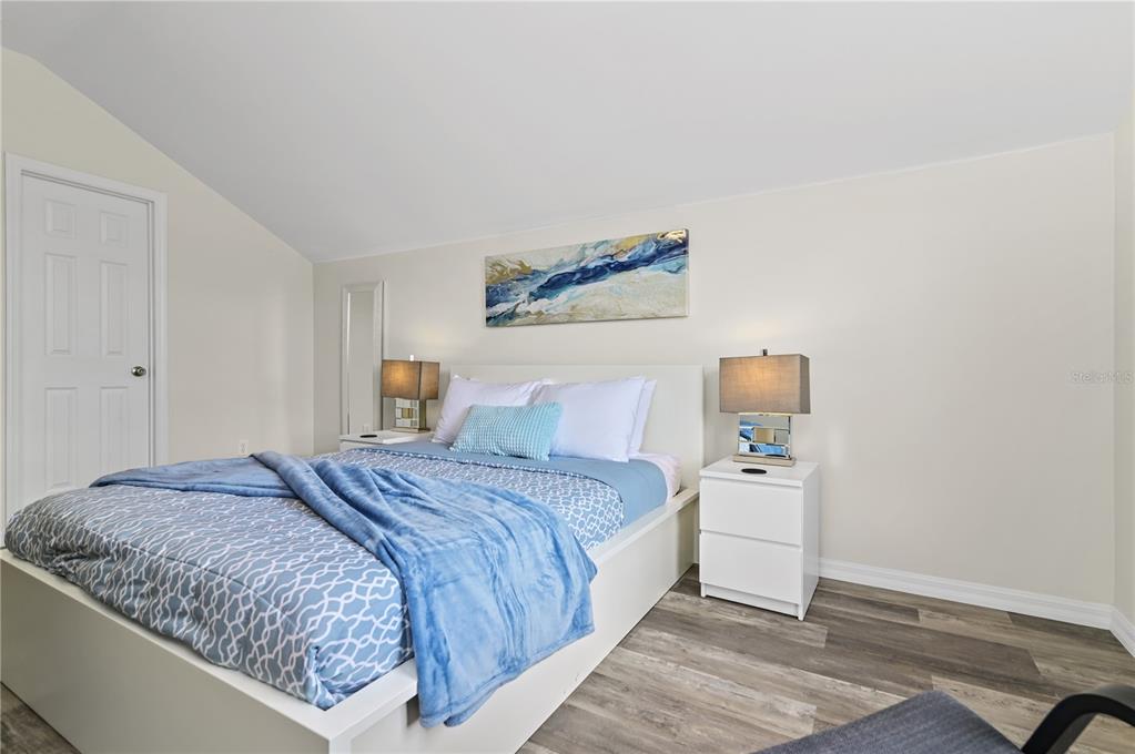 16640 Palm Spring Drive Clermont, FL 34714 - Photo 48 of 79 a bedroom with a bed and a lamp