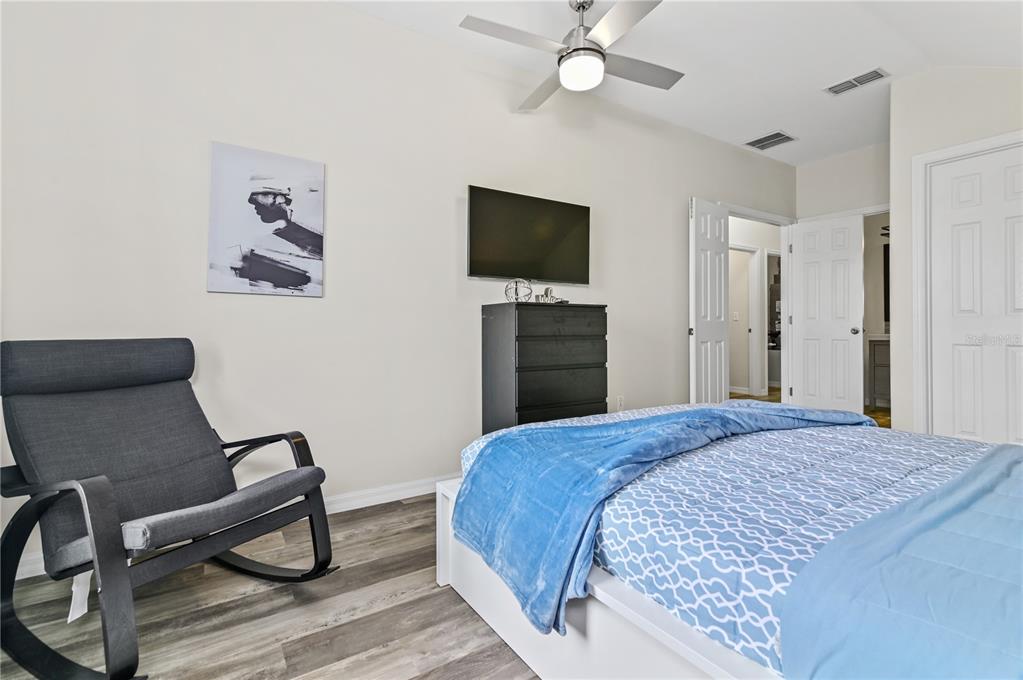 16640 Palm Spring Drive Clermont, FL 34714 - Photo 49 of 79 a bedroom with a bed and a flat screen tv