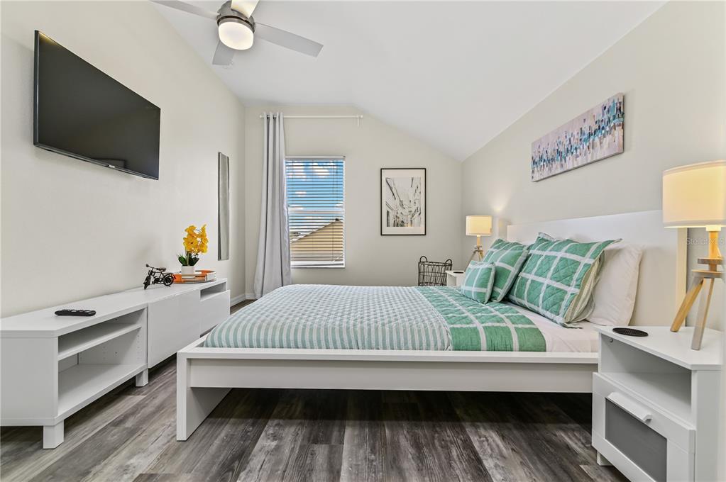 16640 Palm Spring Drive Clermont, FL 34714 - Photo 53 of 79 a bedroom with a bed and a flat screen tv