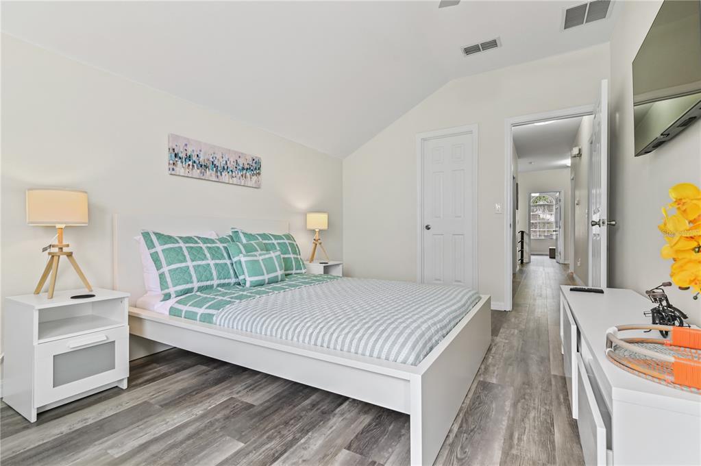 16640 Palm Spring Drive Clermont, FL 34714 - Photo 54 of 79 a bedroom with a bed and wooden floor