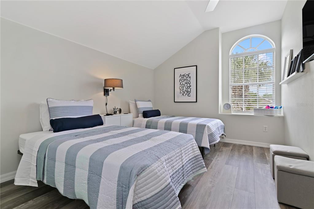 16640 Palm Spring Drive Clermont, FL 34714 - Photo 62 of 79 a bedroom with two beds and a window