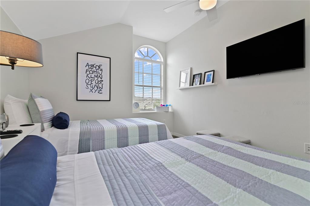 16640 Palm Spring Drive Clermont, FL 34714 - Photo 63 of 79 a bedroom with a bed and a flat screen tv