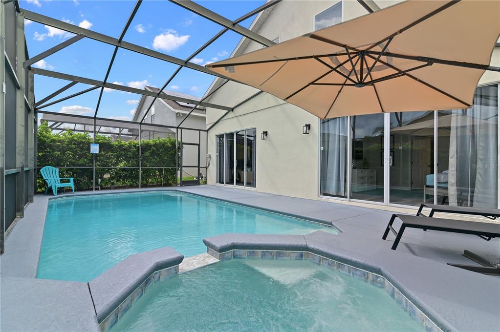 16640 Palm Spring Drive Clermont, FL 34714 - Photo 68 of 79 a view of a backyard with a small deck and a chair