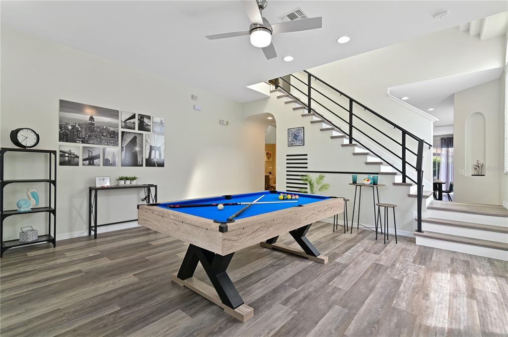 16640 Palm Spring Drive Clermont, FL 34714 - Photo 10 of 79 a bedroom with furniture and a wooden floor