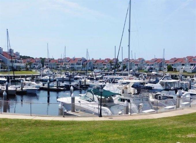 4396 Baldwin Avenue, Unit 82 Little River, SC 29566 - Photo 26 of 35 Dock area featuring view of marina, a water view, and a lawn