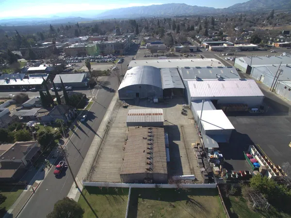 an aerial view of a house with a lake view