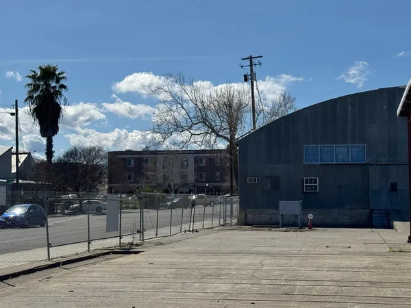 a view of a terrace with a table and chairs