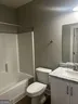 a bathroom with a sink and toilet