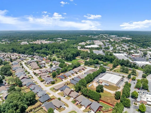 a kitchen with stainless steel appliances granite countertop a stove microwave and cabinets