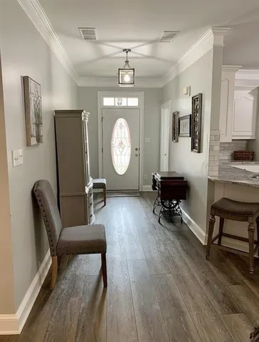 a bedroom with a bed and a ceiling fan