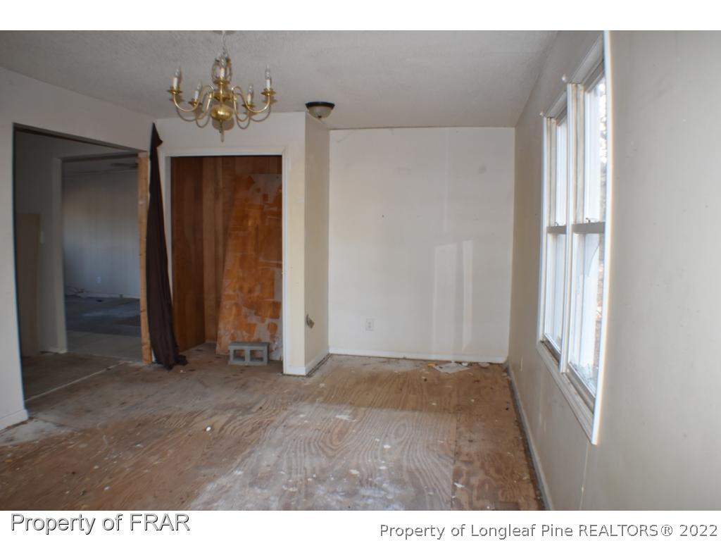 216 Sands Road Carthage, NC 28327 - Photo 12 of 28 a view of an entryway with a chandelier