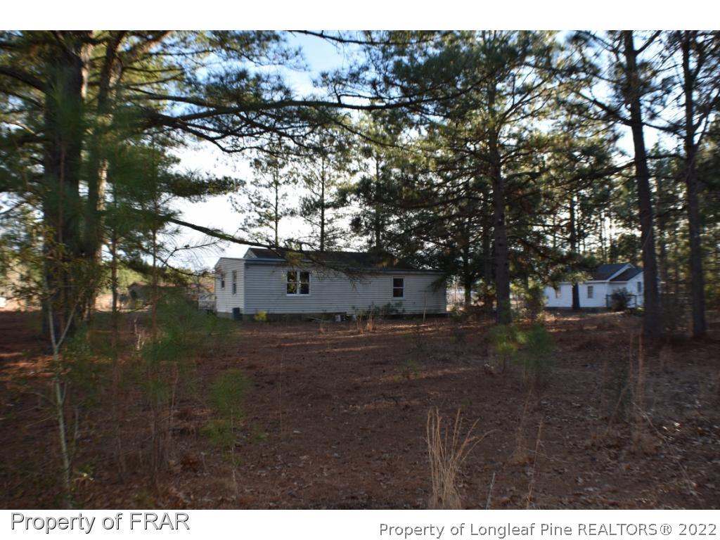 216 Sands Road Carthage, NC 28327 - Photo 28 of 28 a view of a tree in the middle of a yard