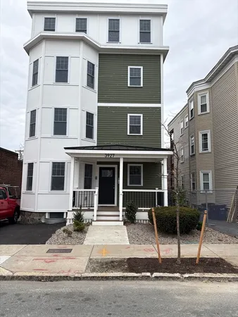 a front view of a house with garage
